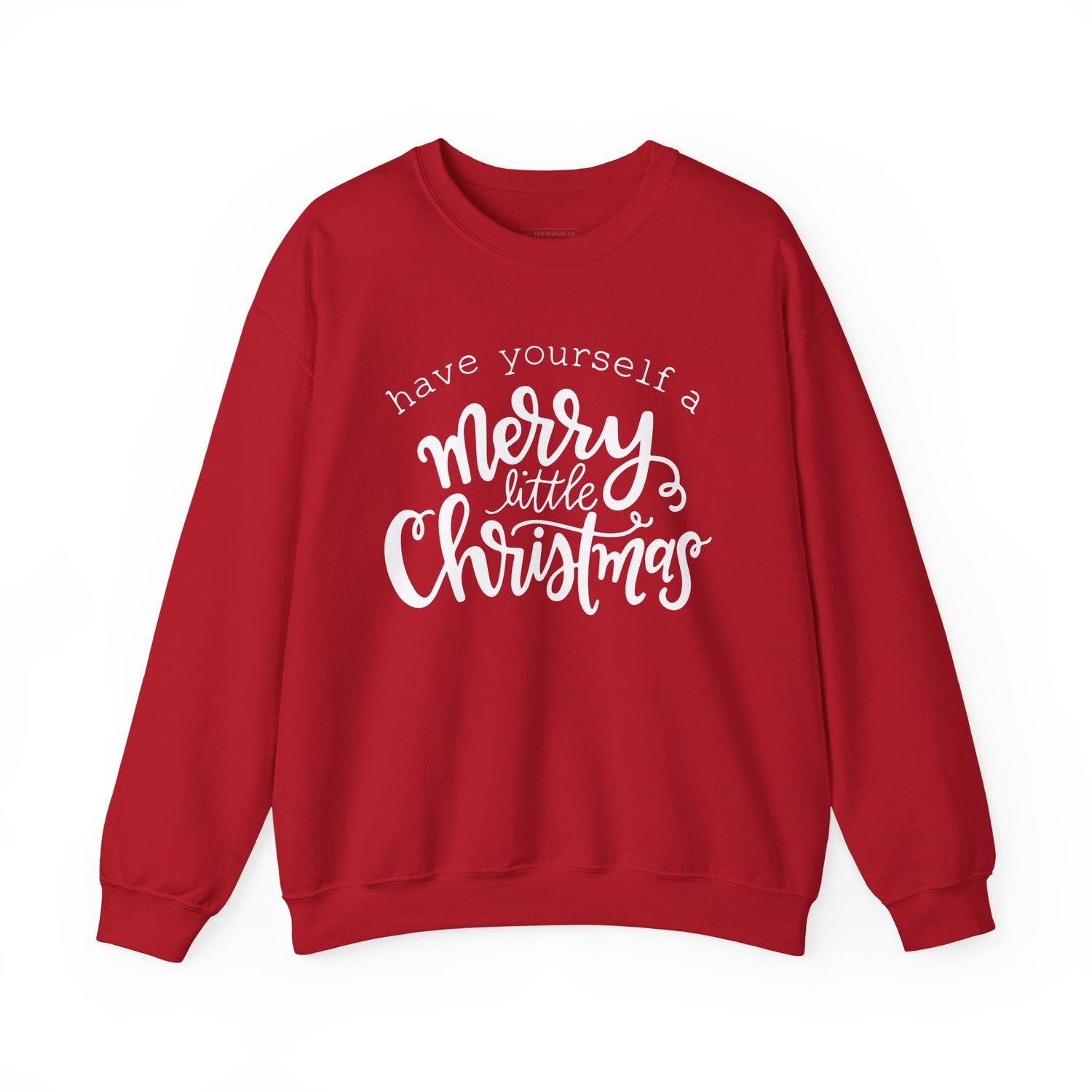 Red sweatshirt with white text 'have yourself a merry little Christmas' on a white background