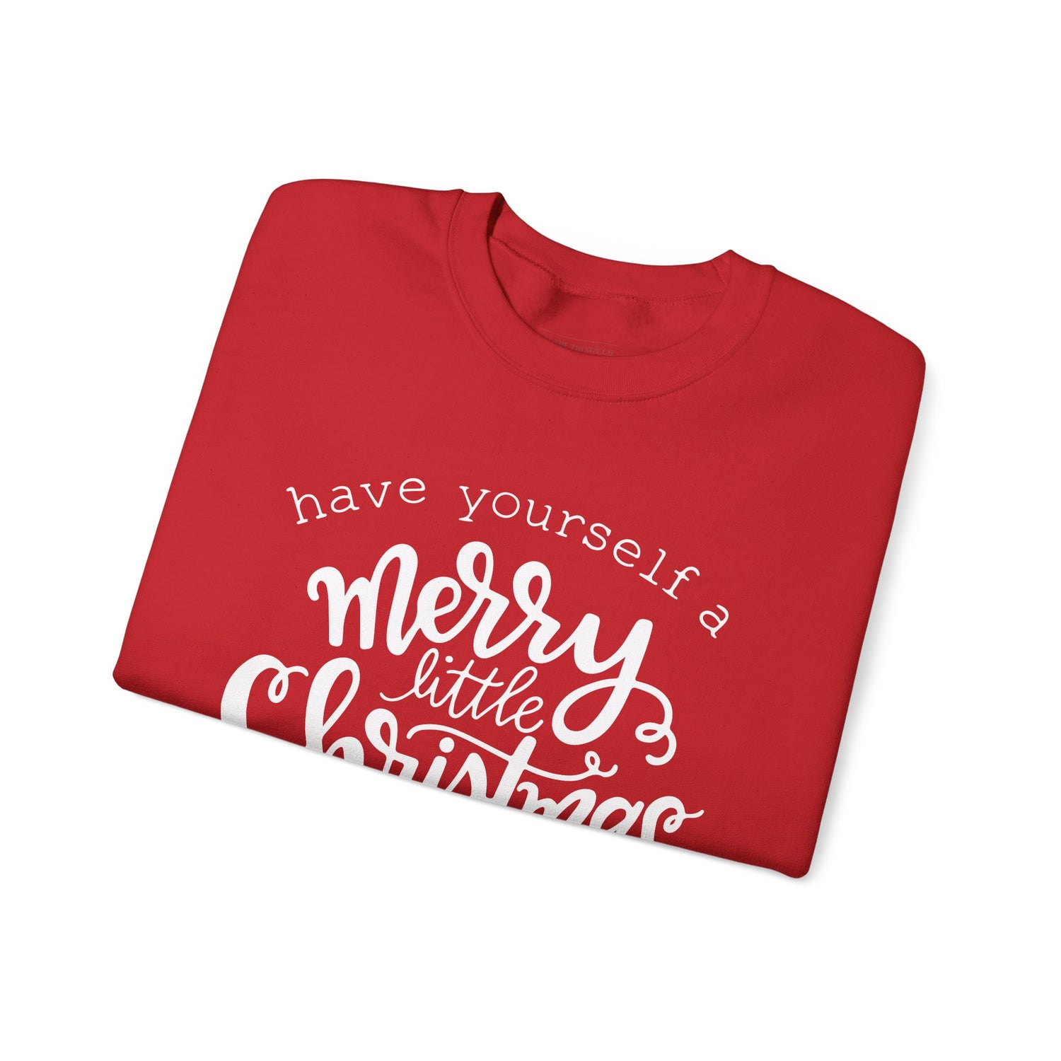 Folded red shirt with white text on a white background