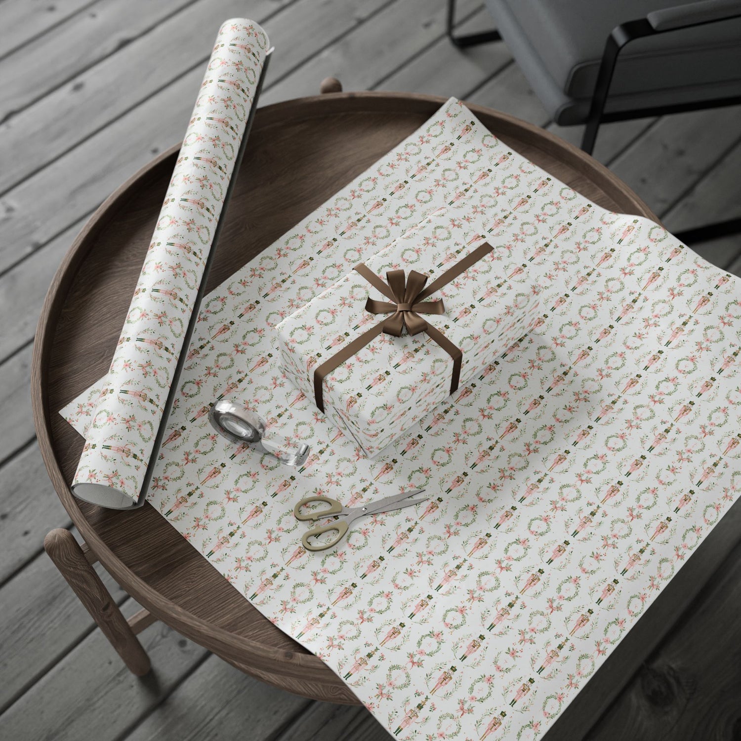 Patterned paper with a bow and scissors on a wooden tray