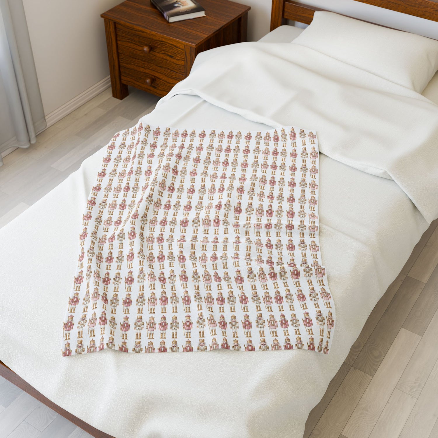 Patterned throw blanket on a bed in a bedroom setting