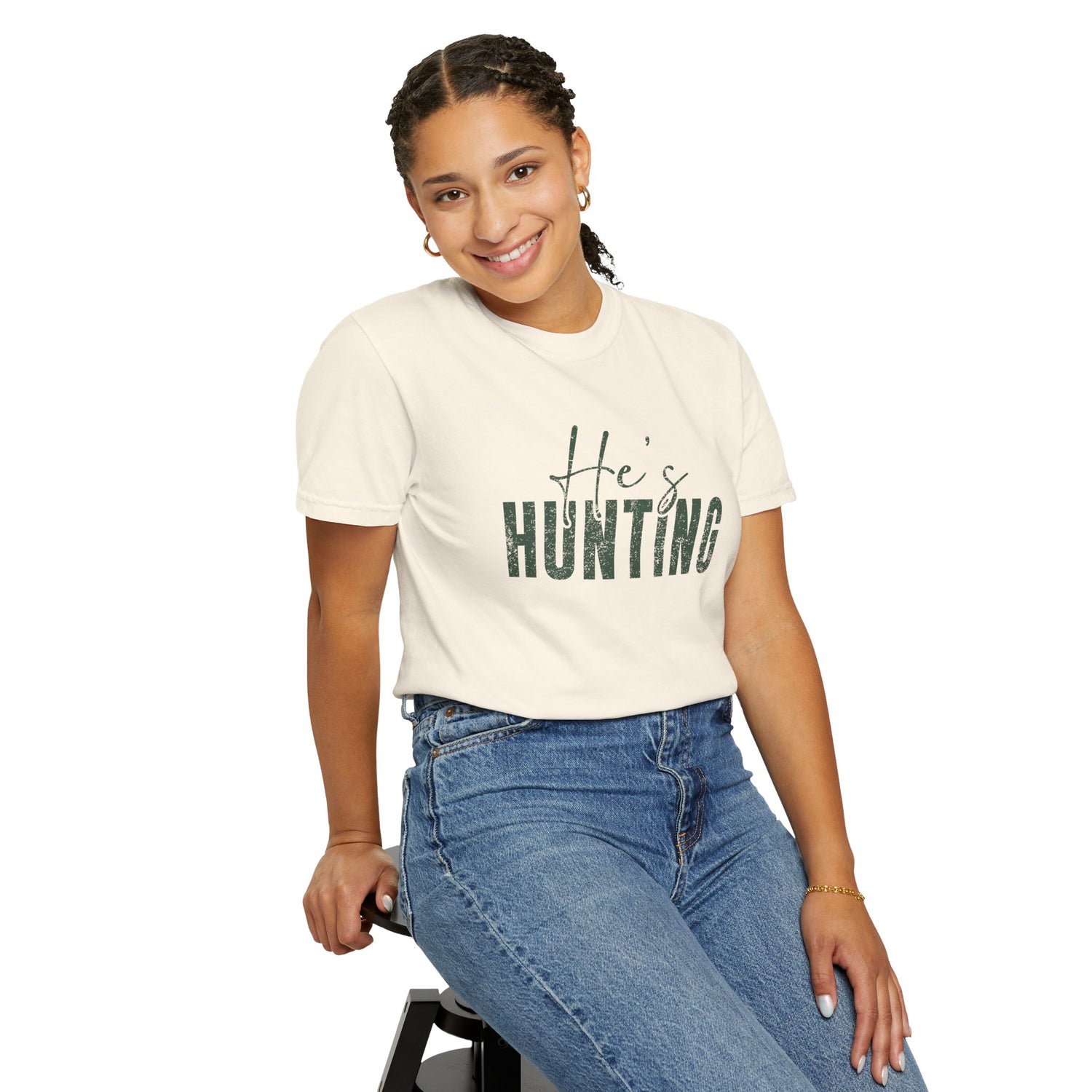 Person wearing a white t-shirt with 'He's Hunting' text and blue jeans on a white background