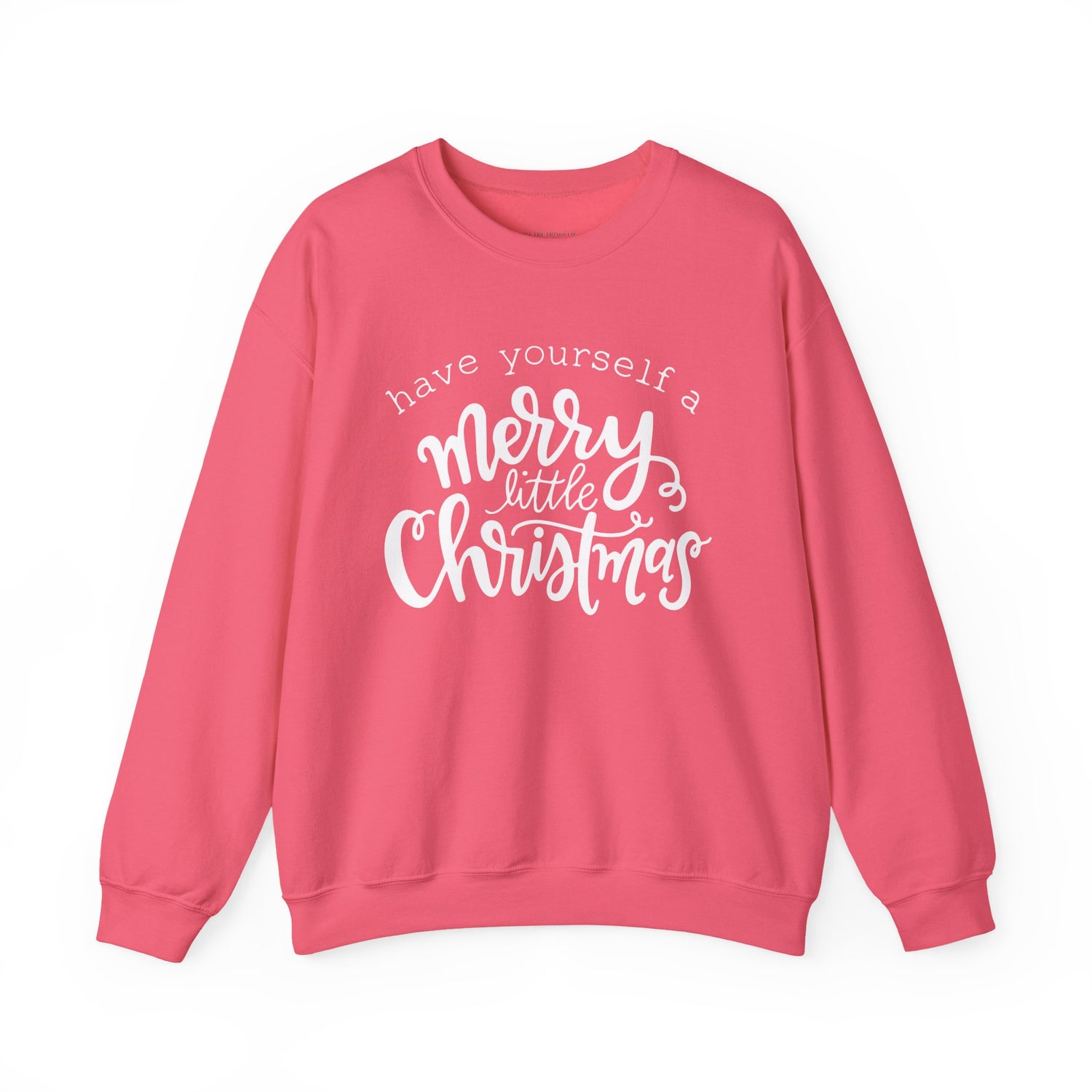 Pink sweatshirt with 'have yourself a merry little Christmas' text on a white background