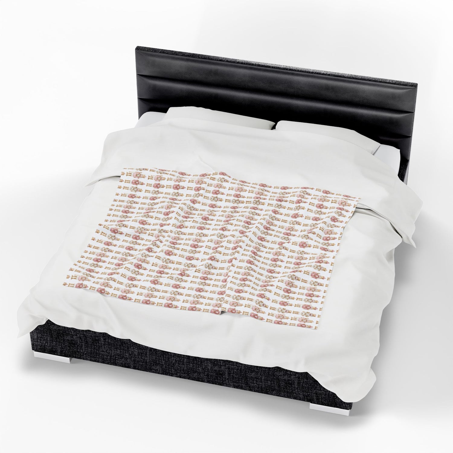 Bed with white comforter featuring printed text on a white background