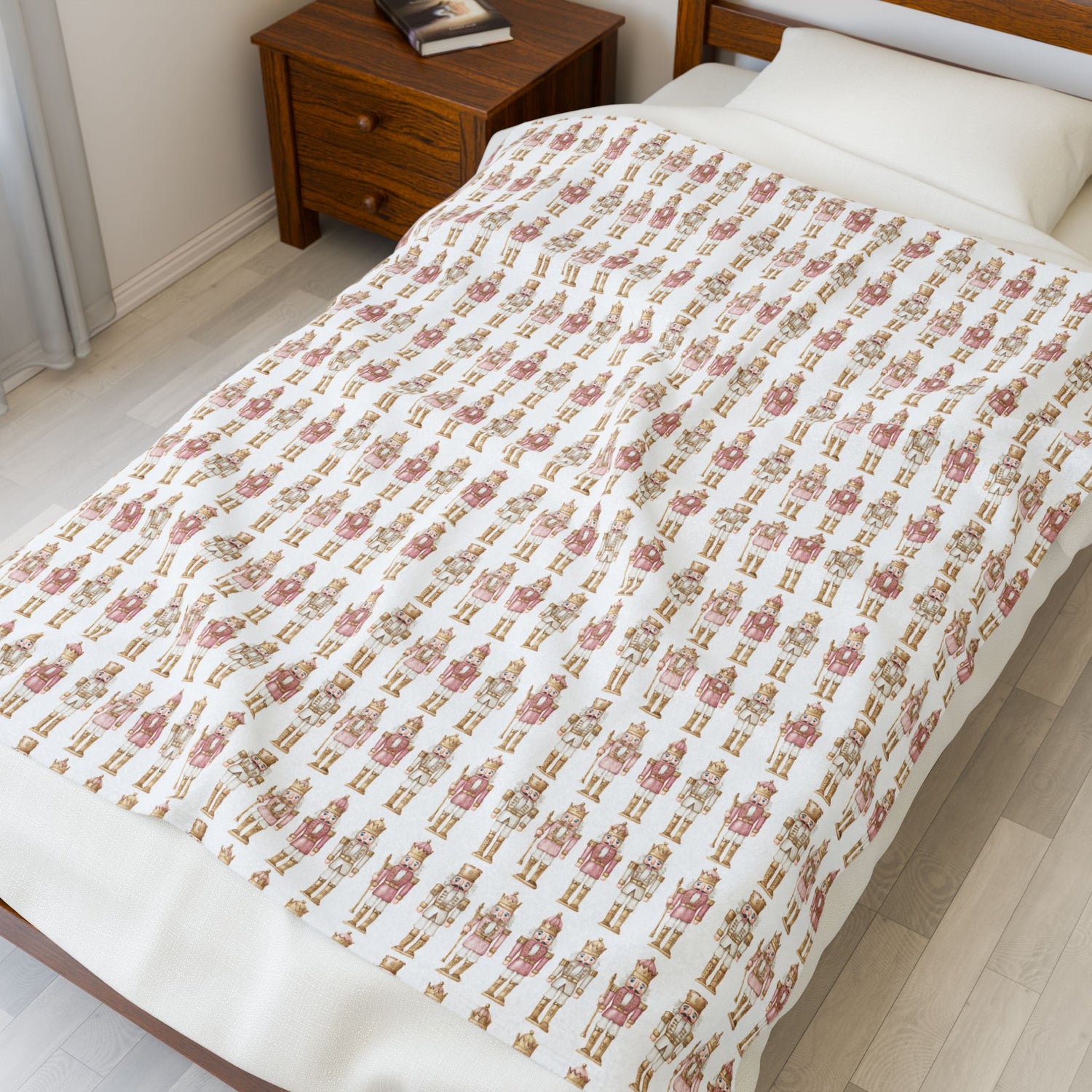 Bed with a floral patterned comforter in a bedroom setting.