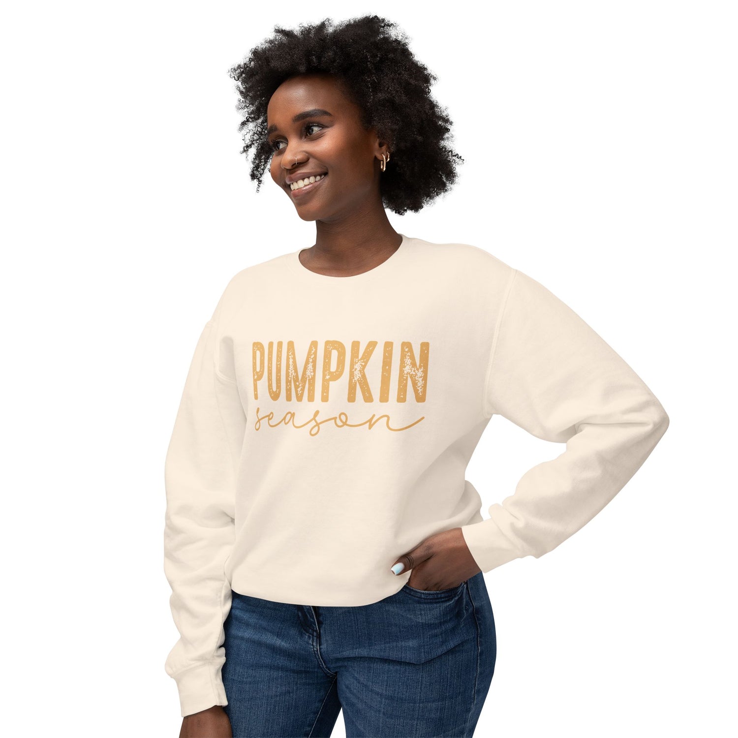 Woman wearing a cream sweatshirt with 'Pumpkin Season' text on a white background