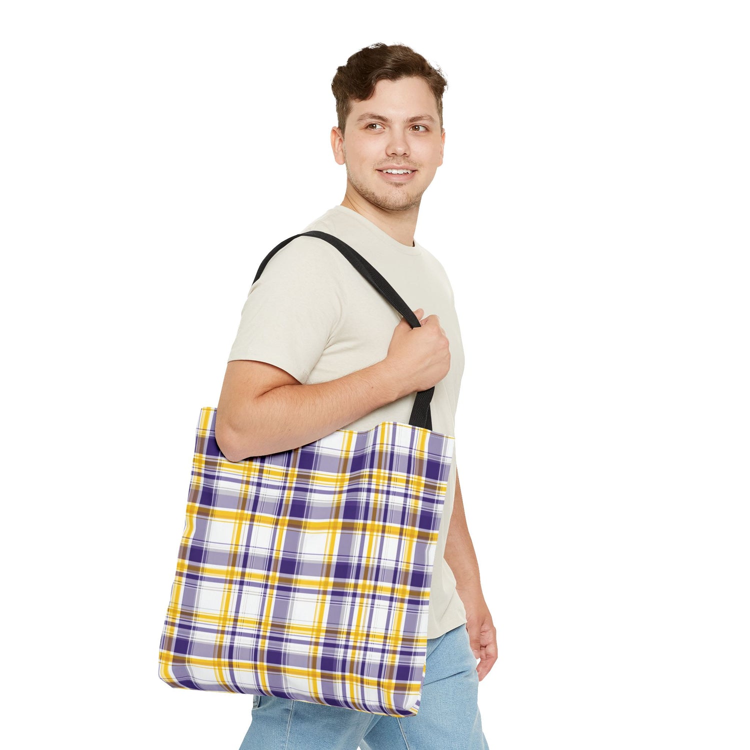 Man holding a plaid bag on a white background