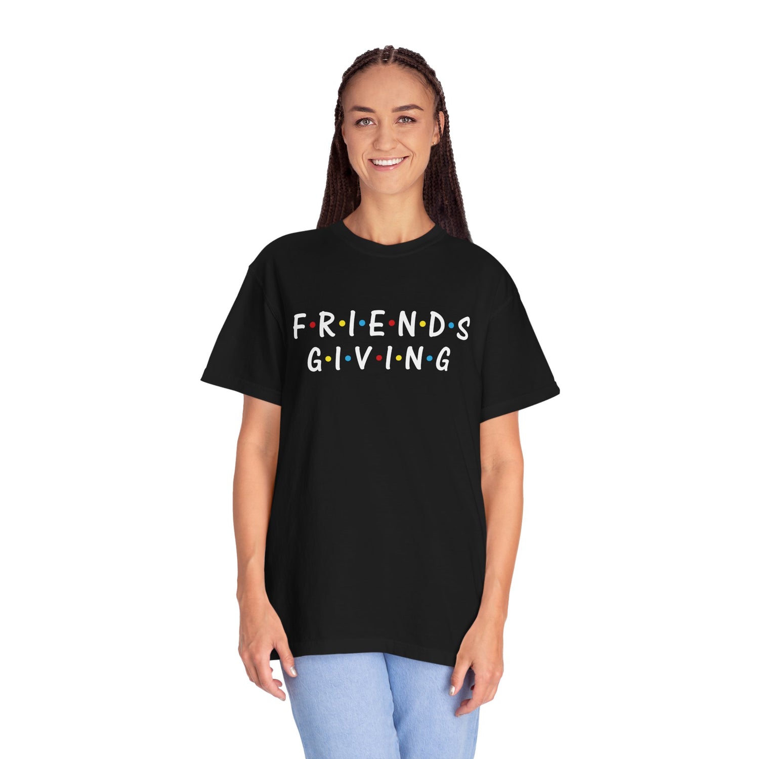 Person wearing a black t-shirt with 'Friendsgiving' text on a white background