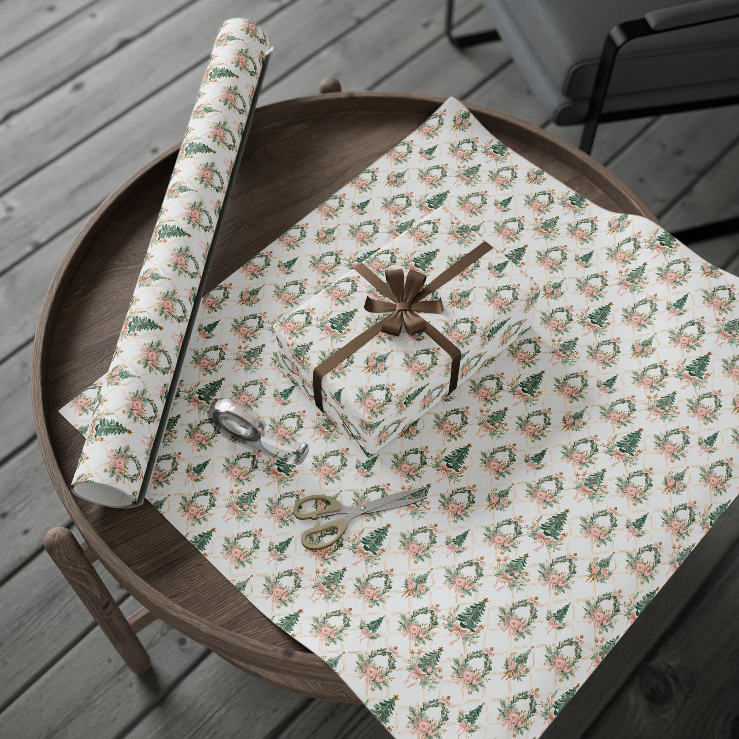 Rolls of floral-patterned paper on a wooden tray with scissors.
