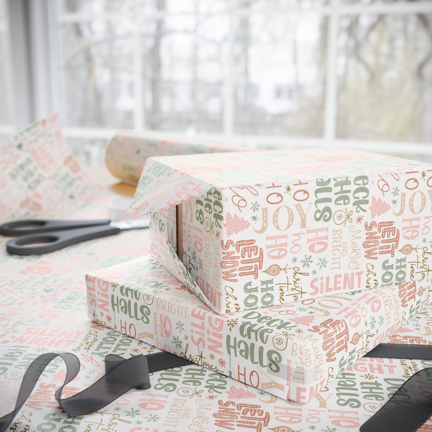Stack of wrapped presents with Christmas-themed wrapping paper on a table.
