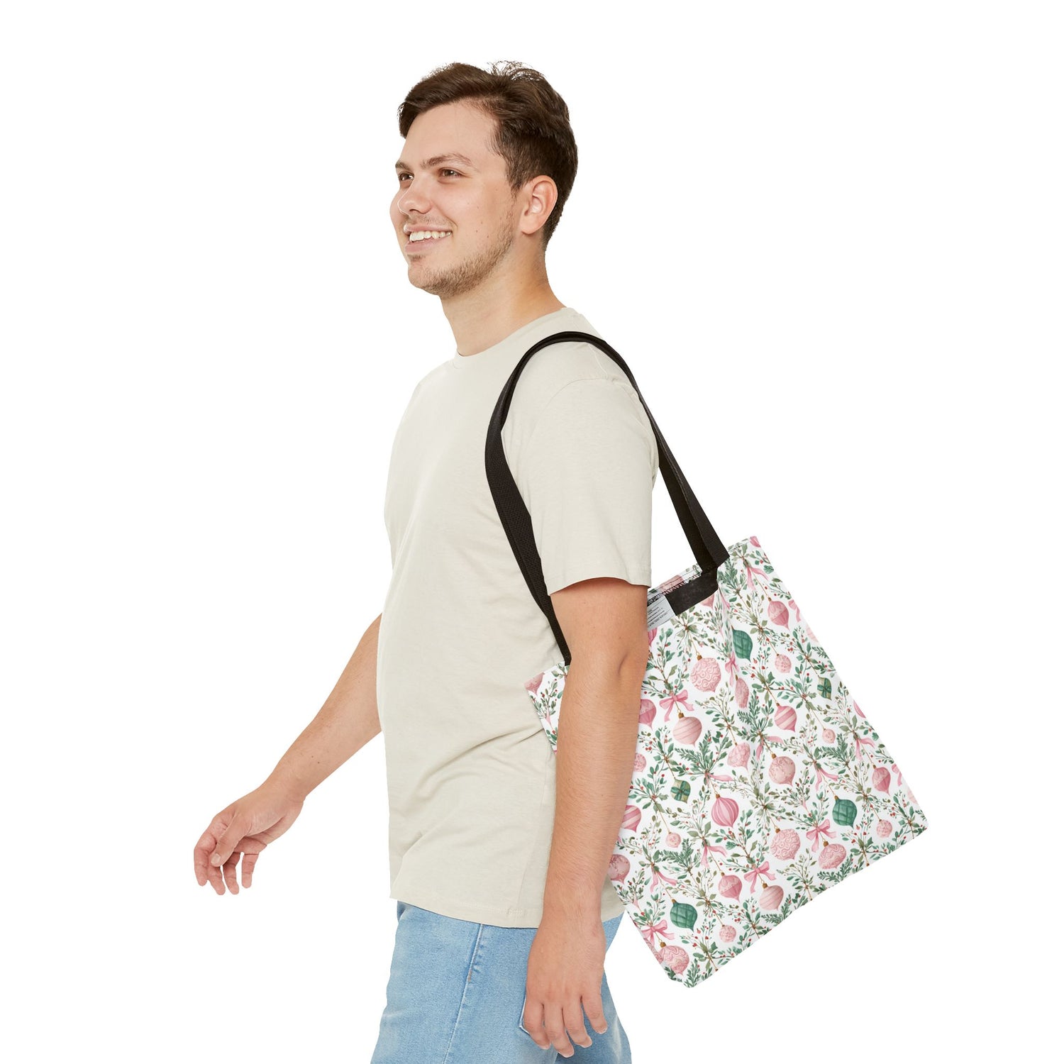Man carrying a floral-patterned bag on a white background