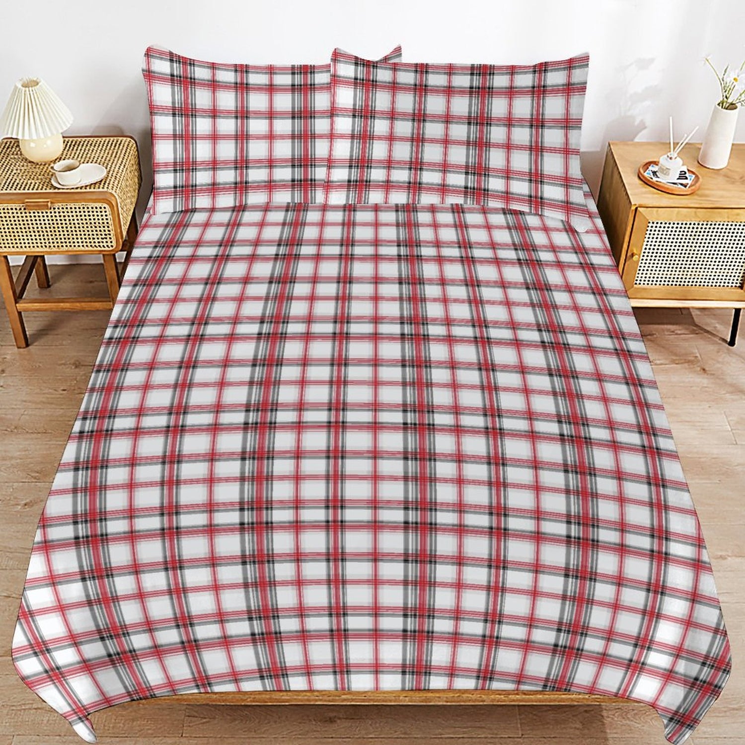 Red and white plaid bedspread on a bed with matching pillows in a bedroom setting.