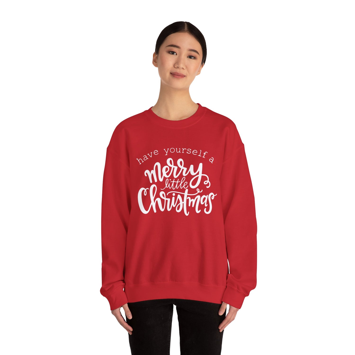 Red sweatshirt with 'have yourself a merry little Christmas' text worn by a person on a white background