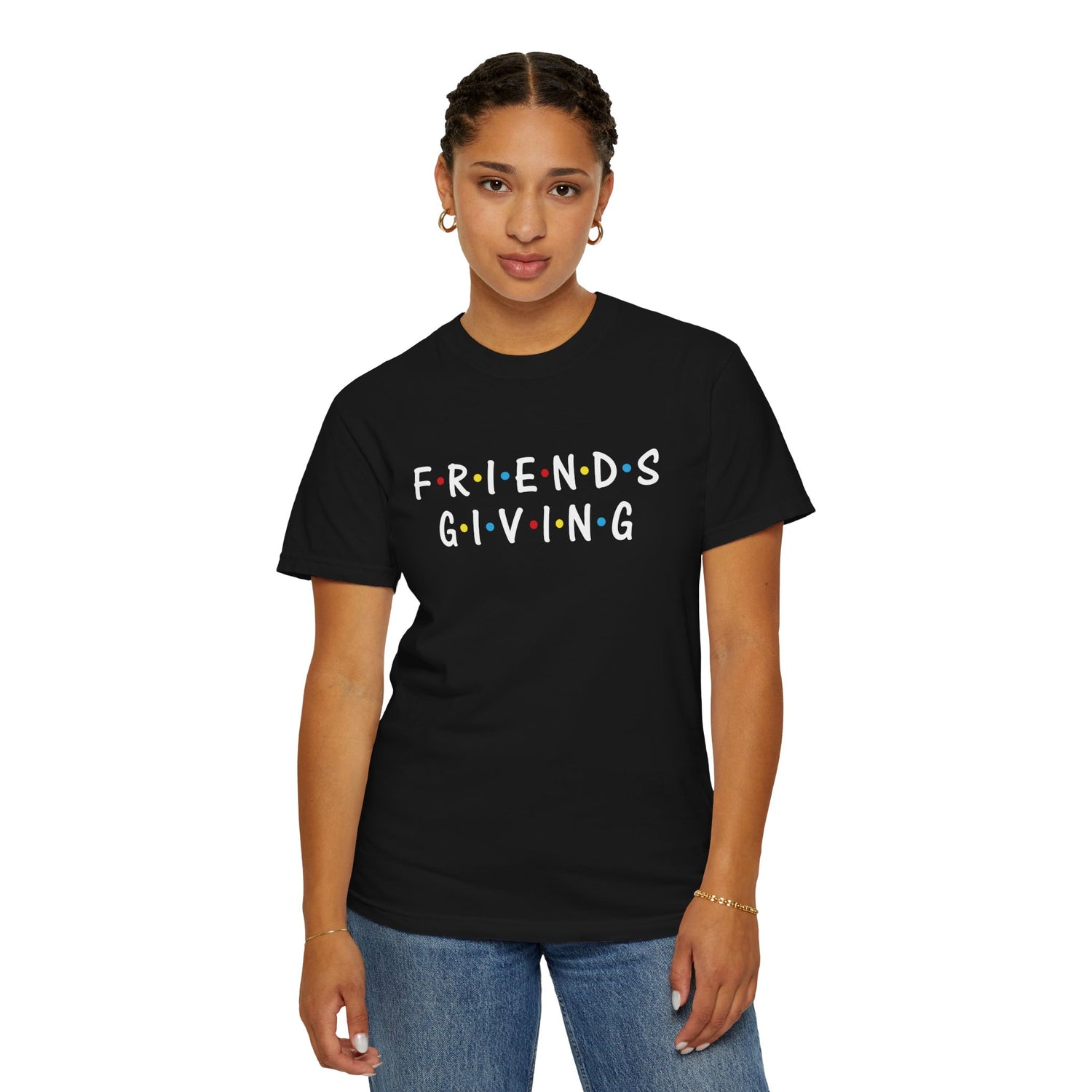 Person wearing a black t-shirt with 'FRIENDS GIVING' text on a white background