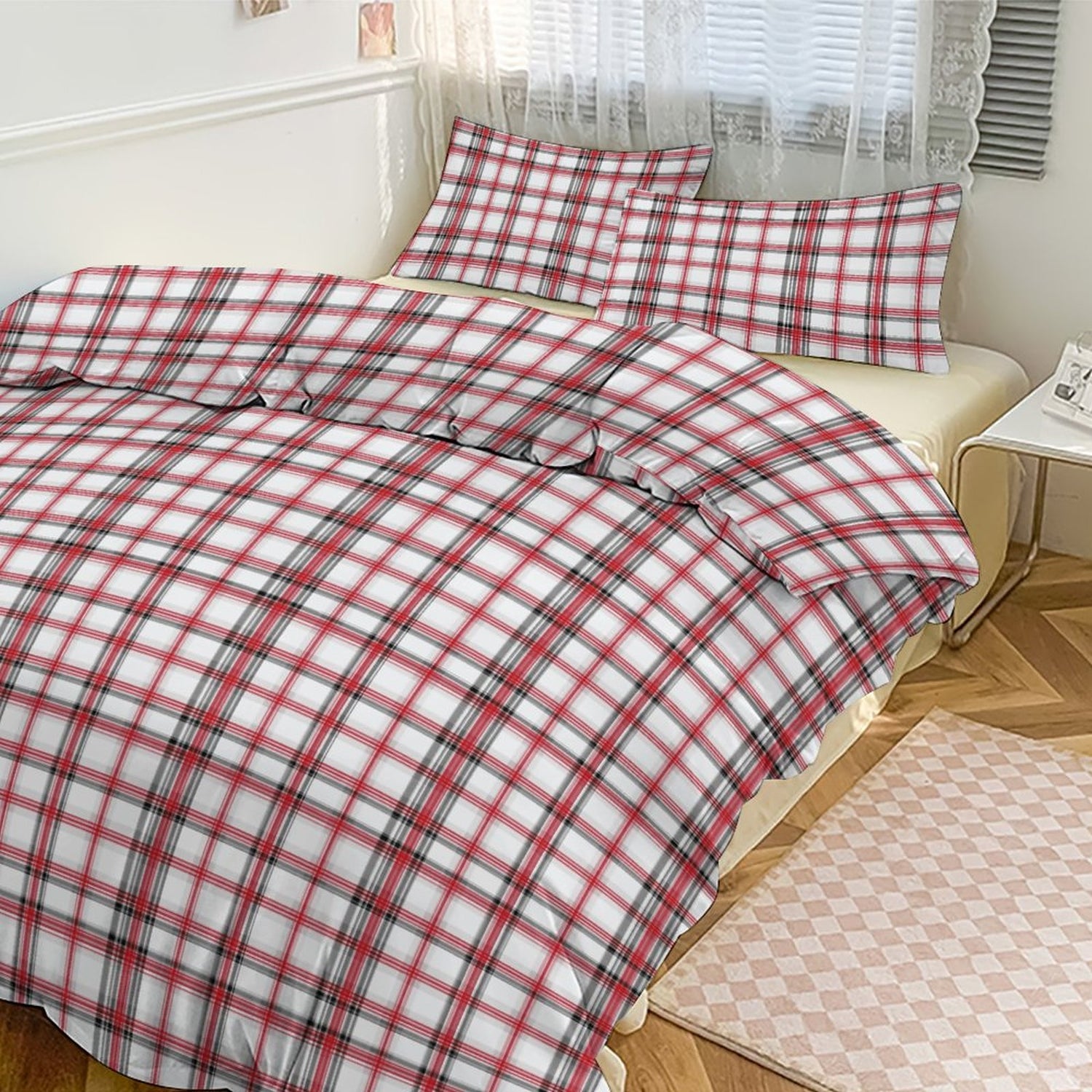 Red and white checkered bedspread on a bed in a bedroom setting.